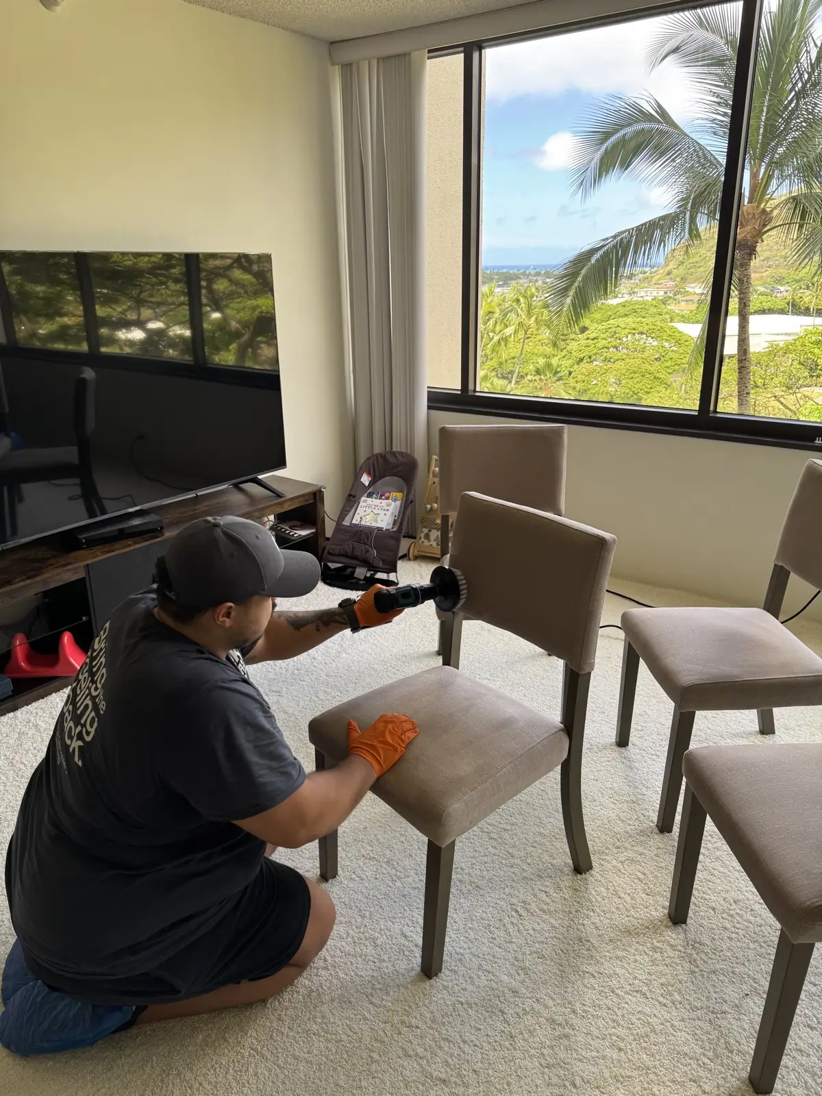 Like Day One owner cleaning dining chairs in an ocean-view home on Oahu