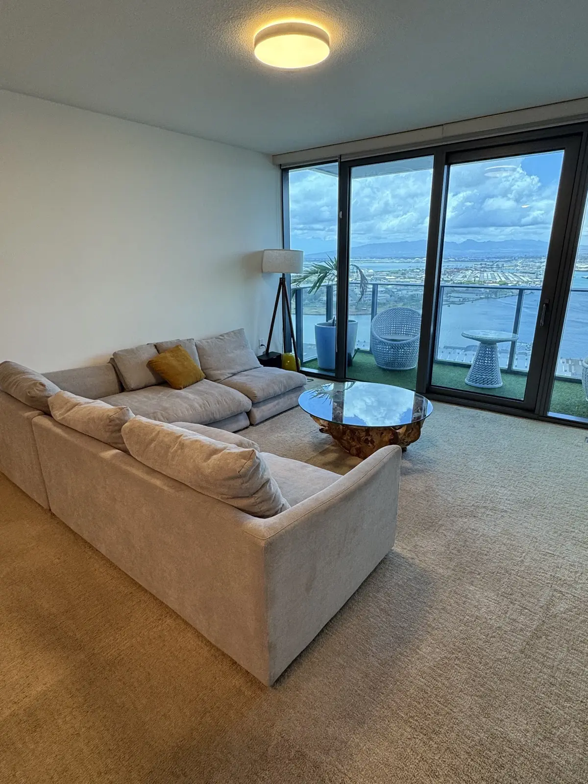 White sectional, ocean-view condo — after cleaning