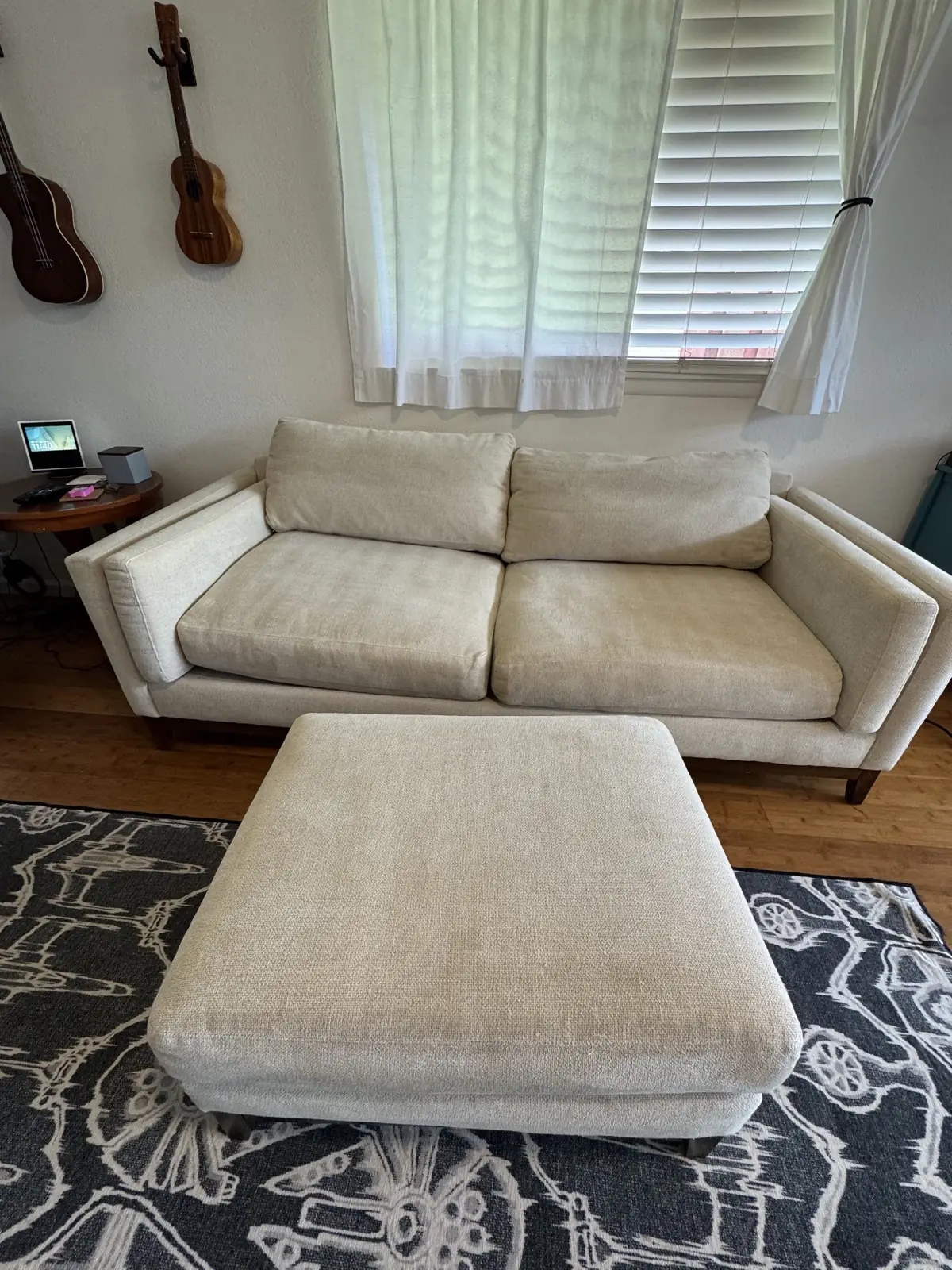 Cream sofa and ottoman — after cleaning