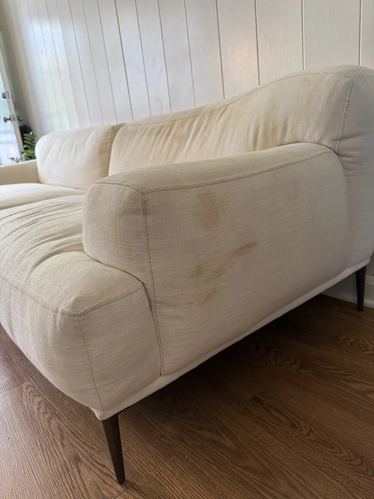 White linen sofa — before cleaning
